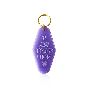 Is Muy Excited Vibes Motel Keychain in Transparent Purple